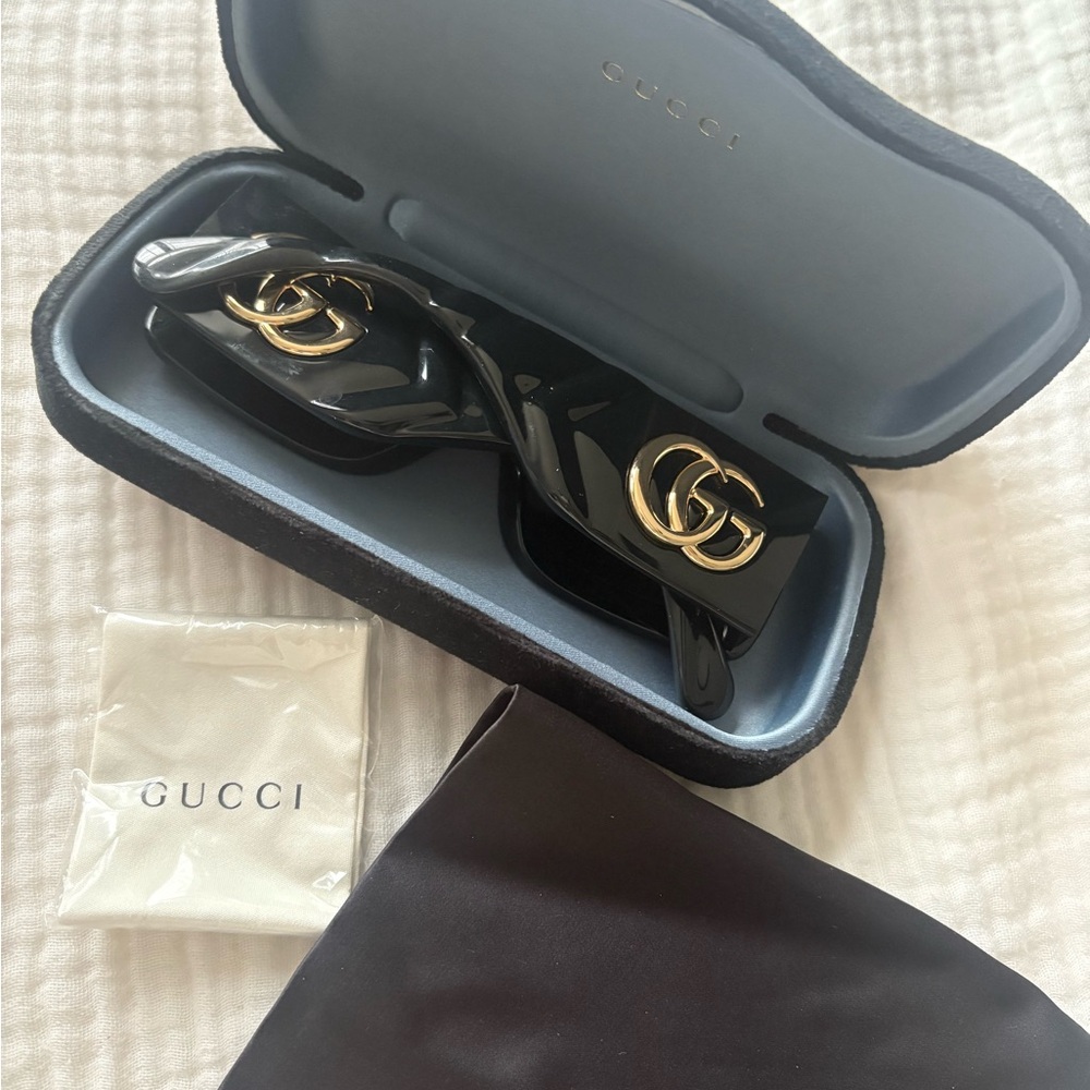 Gucci Glossy Black Sunglasses with Gold Accents
